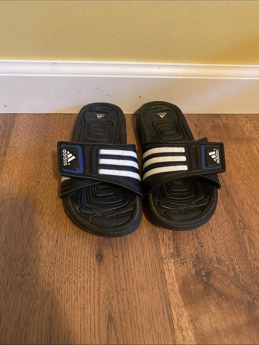 adidas Kids Black Slide Sandals with White Stripes and Blue Accent